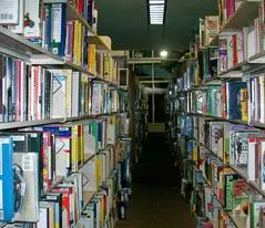 A long row of shelves filled with books.