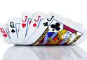 A close up of playing cards on top of each other