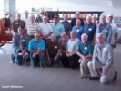 A group of older men posing for a picture.