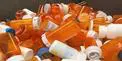 A pile of orange and white plastic bottles.